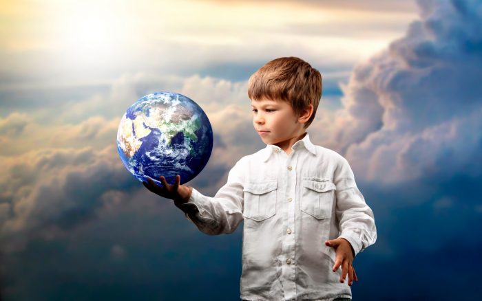 1438236195_the-boy-is-holding-the-planet-earth